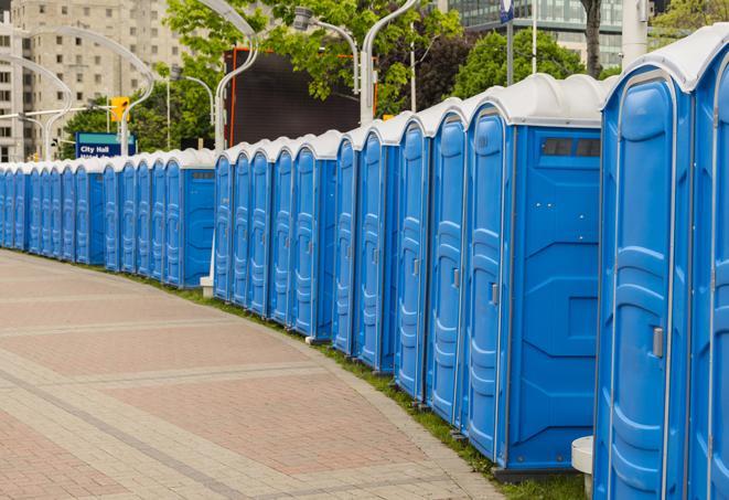 a row of portable restrooms set up for a large athletic event, allowing participants and spectators to easily take care of their needs in Aloha